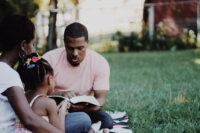 black-family-dad-reads-bible