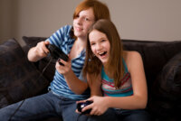 young-teens-play-video-games-happy